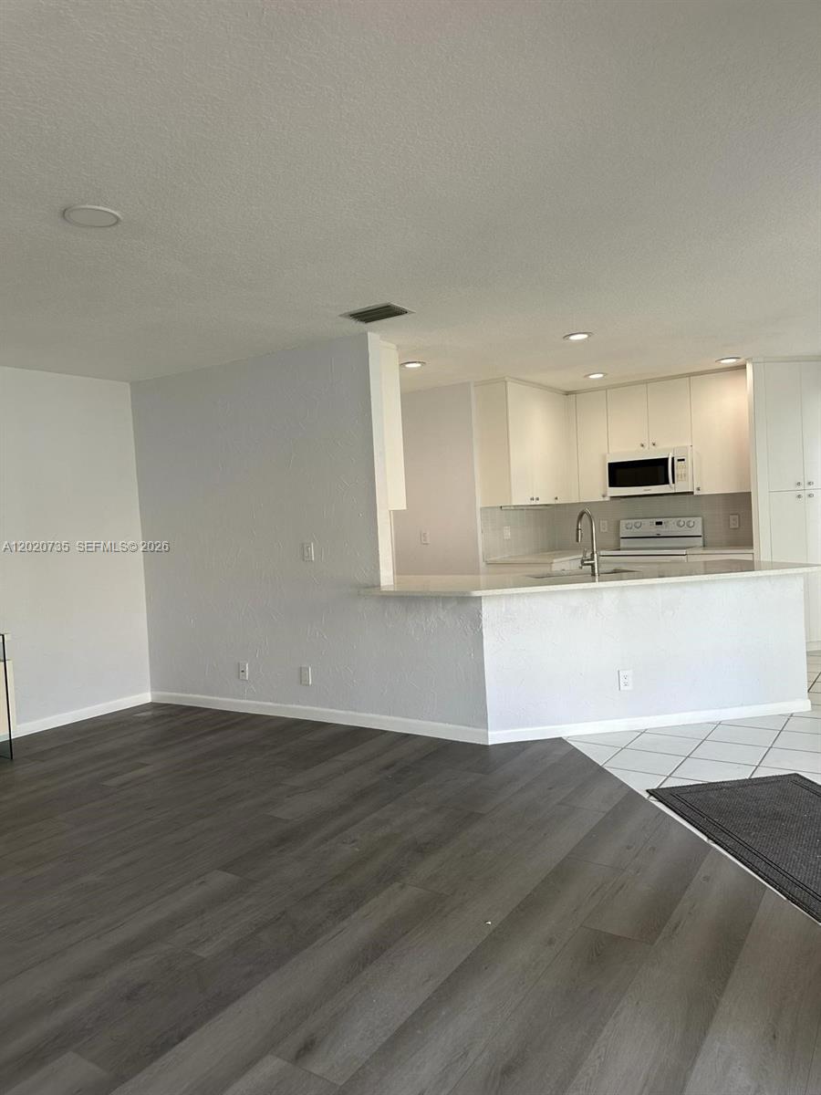 17244 Balboa Point Way Boca Raton, FL 33487 - Photo 11 of 66 a view of kitchen with wooden floor