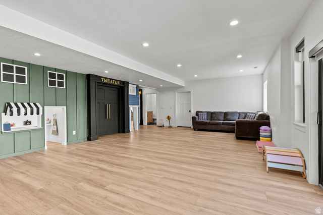 3111 South 1250 West Logan, UT 84321 - Photo 23 of 51 Spacious recreation area featuring wood-finish flooring and recessed lighting