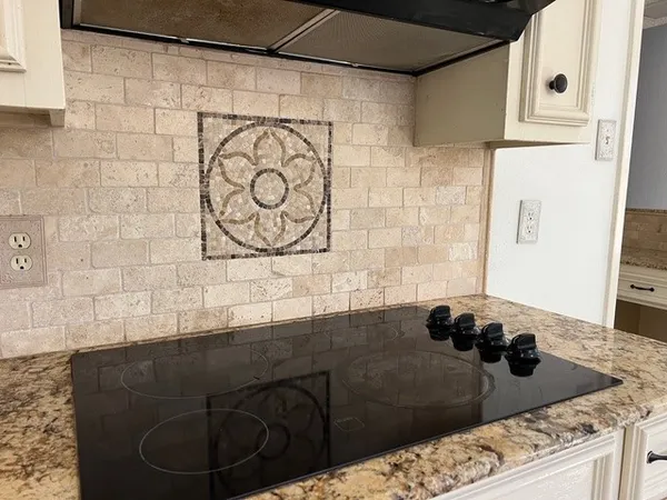 a kitchen with a sink and a stove