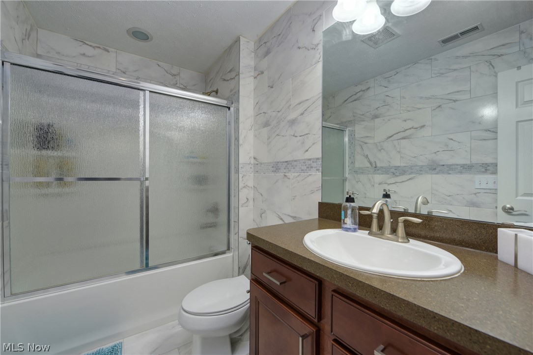 3600 Case Road Avon, OH 44011 - Photo 16 of 35 Renovated bathroom with gorgeous tile and connects to extra room which is presently being utilized as a bedroom