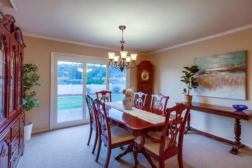 2220 Valley Mill Road El Cajon, CA 92020 - Photo 8 of 34 a dining room with furniture potted plants and wooden floor