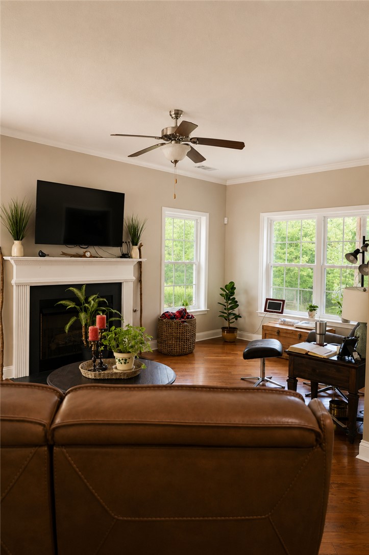 190 Fred Bradford Road Iva, SC 29655 - Photo 11 of 32 This inviting living area features warm wood floors and abundant natural light, perfect for everyday living.