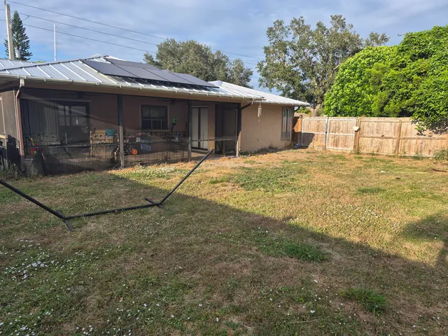 a house with trees in the background