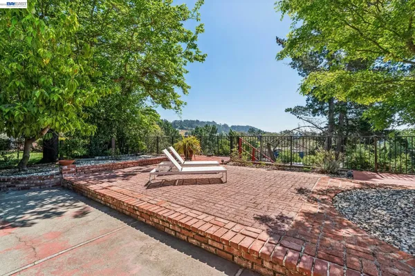 a view of a house with backyard porch and sitting area