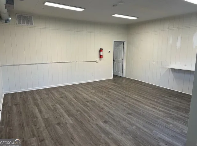 a view of a livingroom with wooden floor