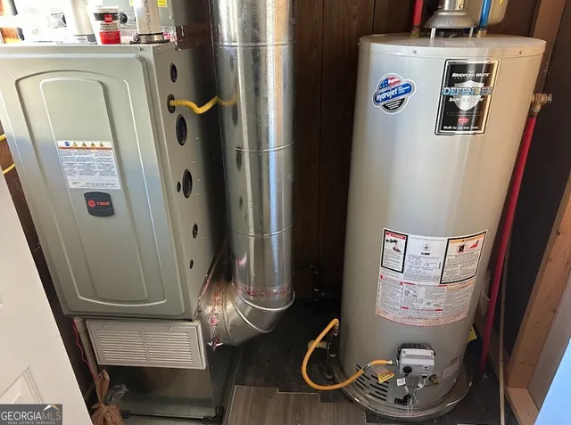 a room with water heater and storage racks