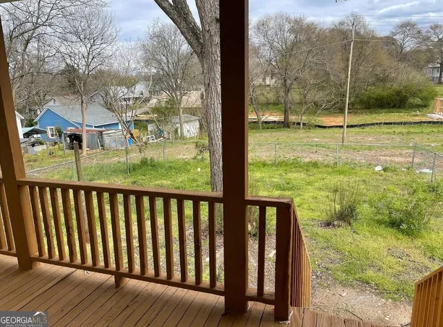 a view of a porch with a yard