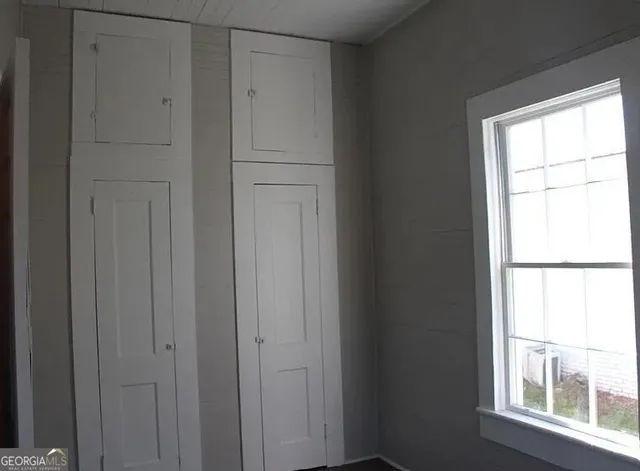 a view of an empty room with a window