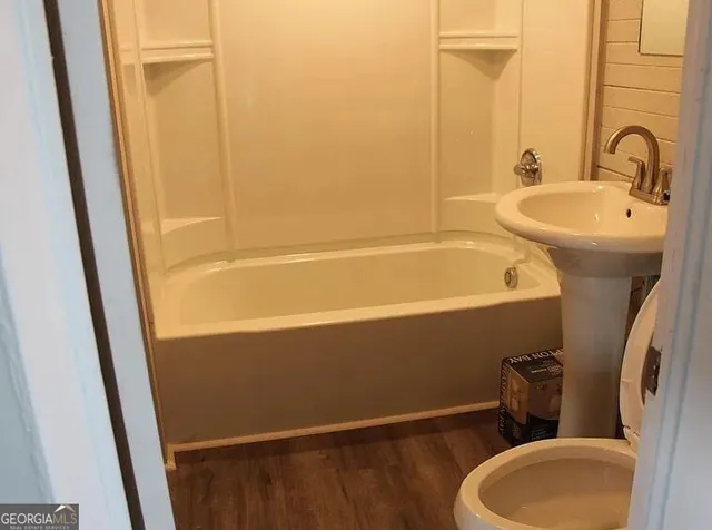 a bathroom with a sink and a toilet