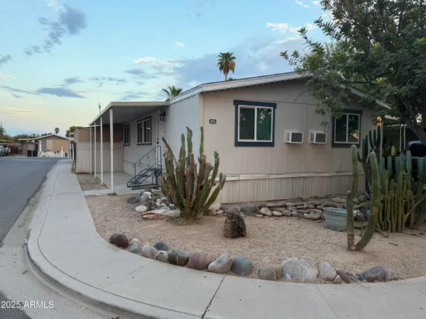 a view of a house with a backyard