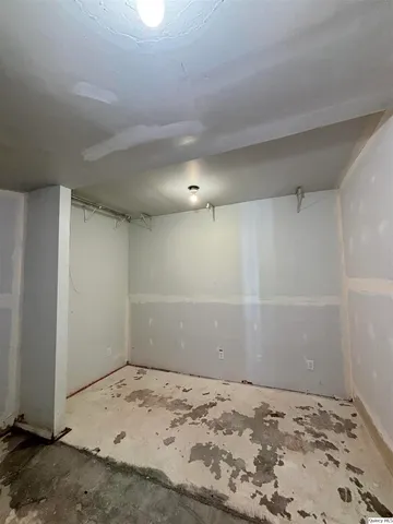 an empty room with a bench