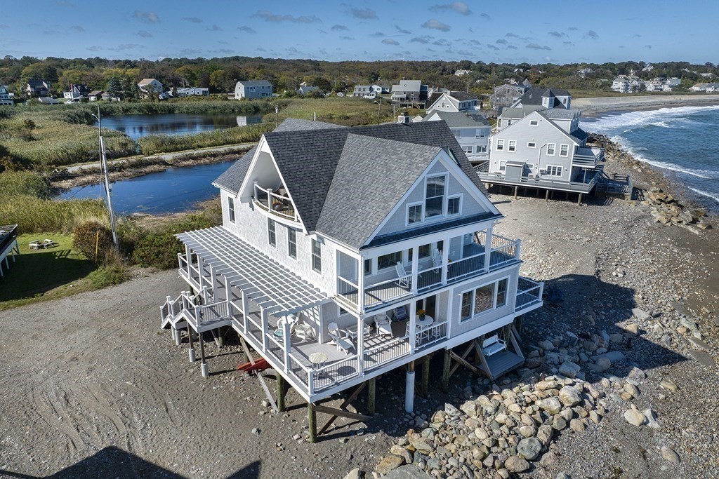 an aerial view of a house with a ocean view