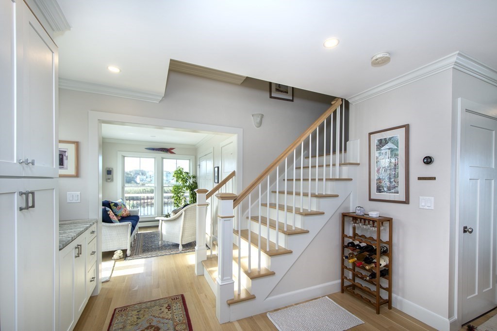 61 Seaside Road Scituate, MA 02066 - Photo 12 of 39 a view of entryway and hall with wooden floor