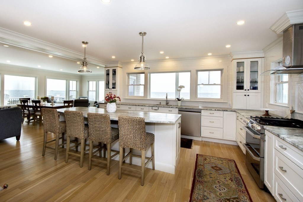 61 Seaside Road Scituate, MA 02066 - Photo 13 of 39 a large kitchen with a table and chairs