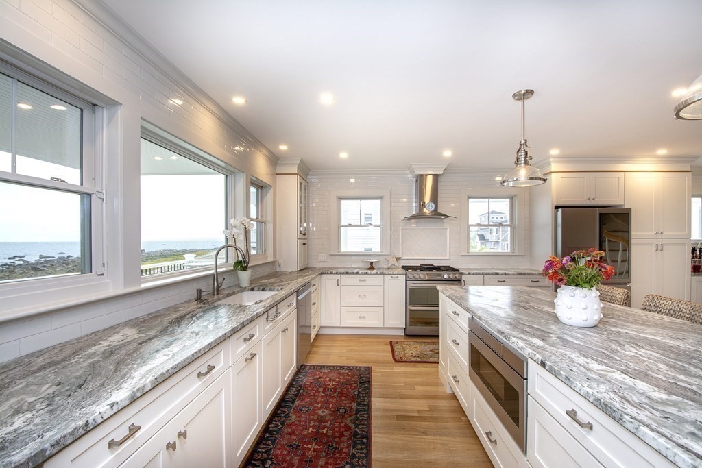 61 Seaside Road Scituate, MA 02066 - Photo 14 of 39 a large kitchen with stainless steel appliances granite countertop a sink stove and refrigerator