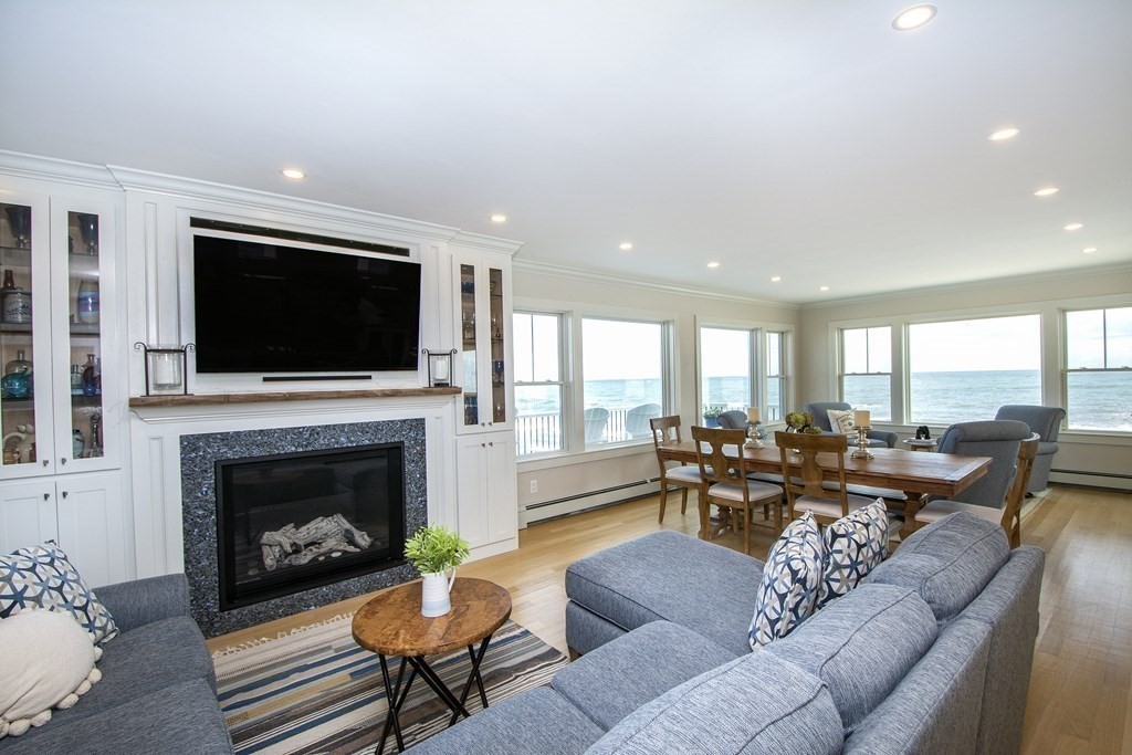 61 Seaside Road Scituate, MA 02066 - Photo 17 of 39 a living room with furniture fireplace and flat screen tv