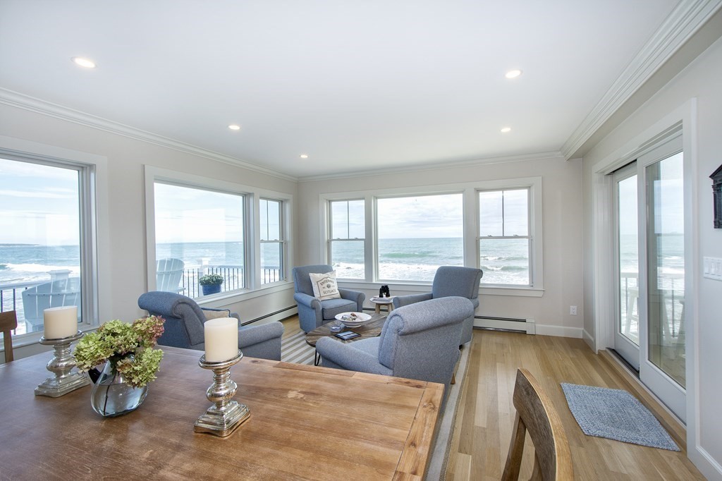 61 Seaside Road Scituate, MA 02066 - Photo 19 of 39 a living room with furniture and floor to ceiling windows