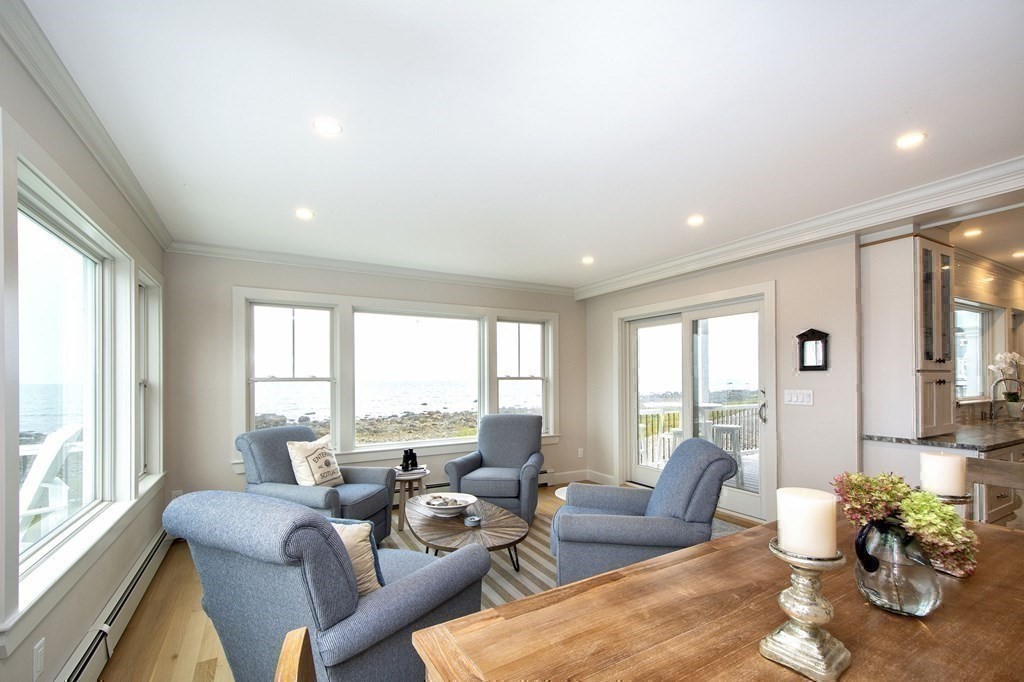 61 Seaside Road Scituate, MA 02066 - Photo 20 of 39 a living room with furniture and floor to ceiling windows