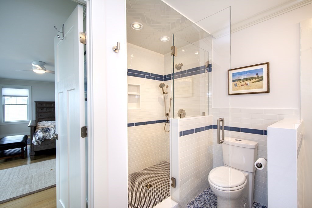 61 Seaside Road Scituate, MA 02066 - Photo 23 of 39 a bathroom with a toilet a sink and a shower
