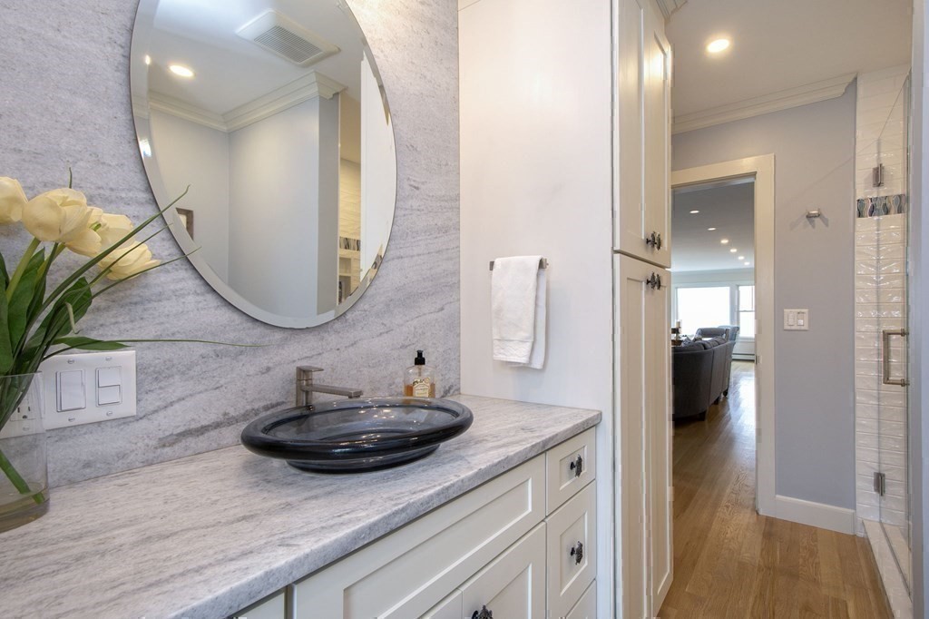 61 Seaside Road Scituate, MA 02066 - Photo 24 of 39 a bathroom with a sink and a mirror
