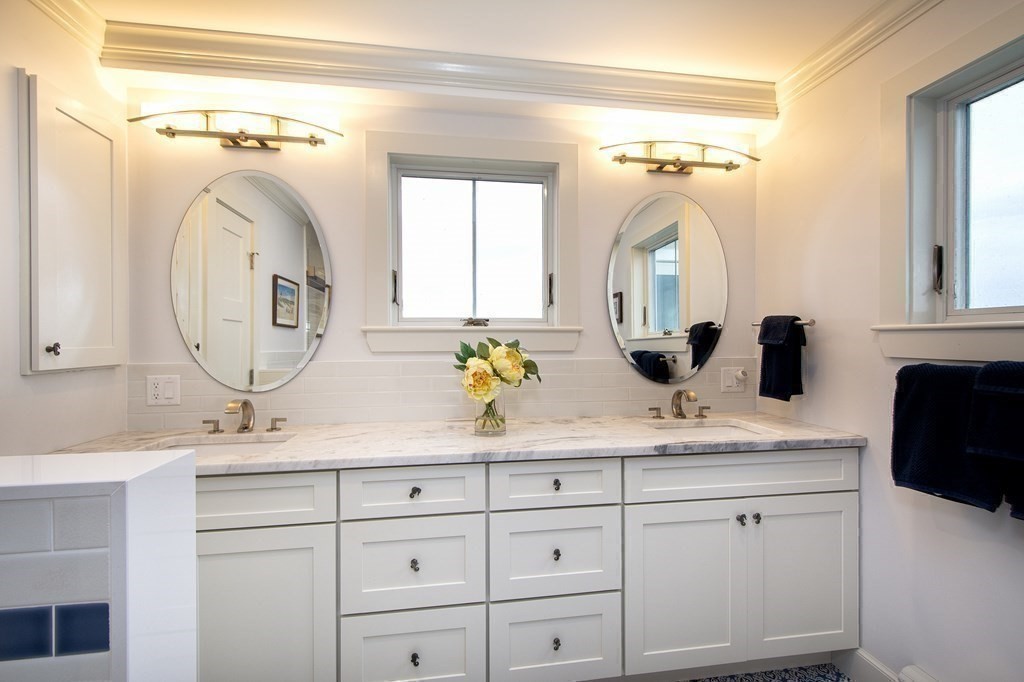 61 Seaside Road Scituate, MA 02066 - Photo 26 of 39 a bathroom with a sink and a mirror