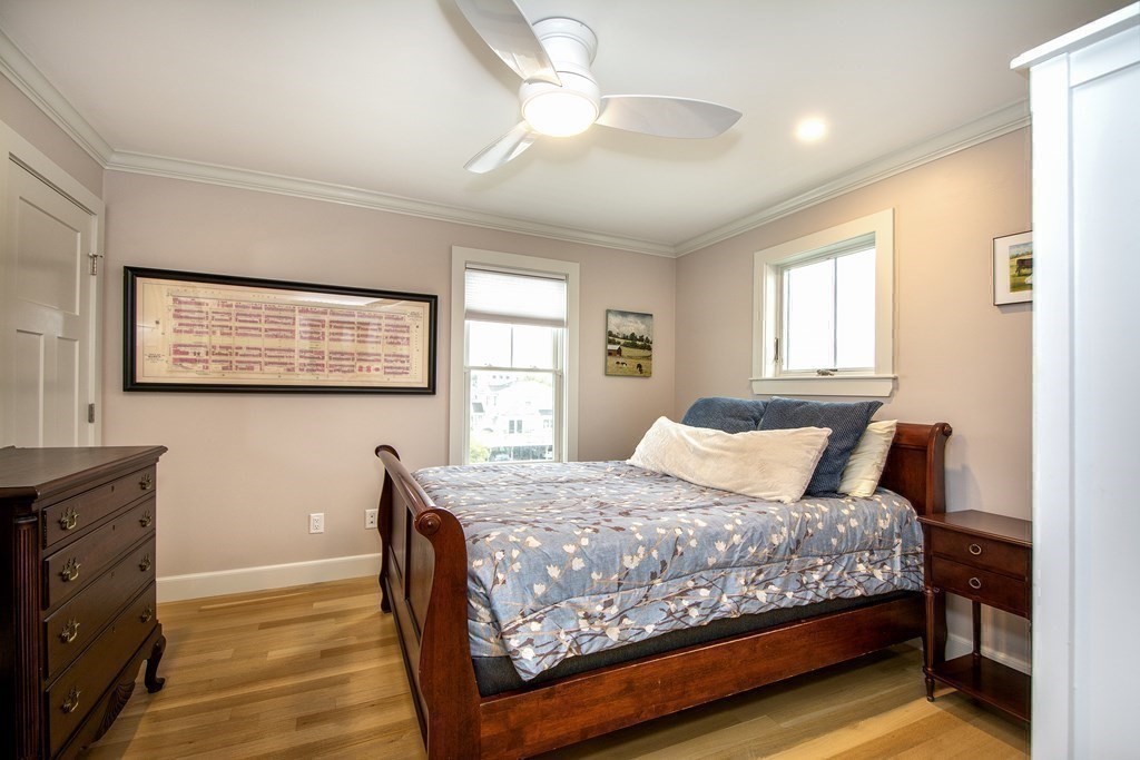 61 Seaside Road Scituate, MA 02066 - Photo 28 of 39 a bedroom with a large bed and a window
