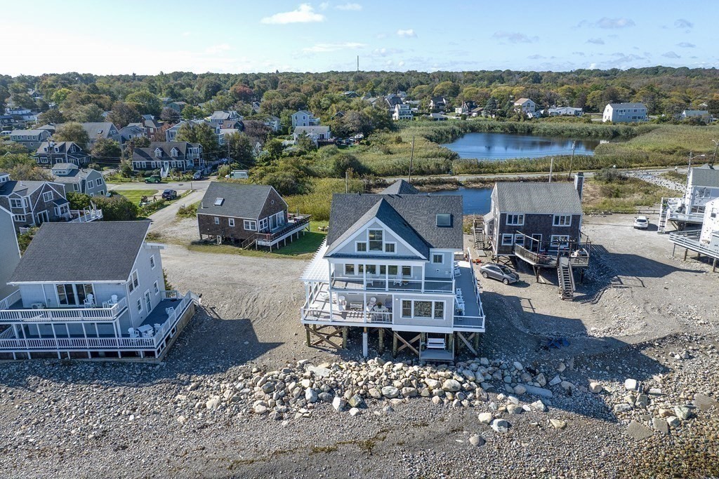 61 Seaside Road Scituate, MA 02066 - Photo 3 of 39 an aerial view of a house with a lake view