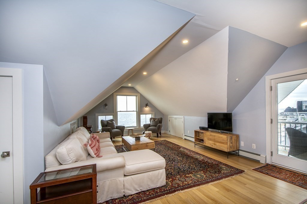 61 Seaside Road Scituate, MA 02066 - Photo 34 of 39 a living room with furniture and a flat screen tv