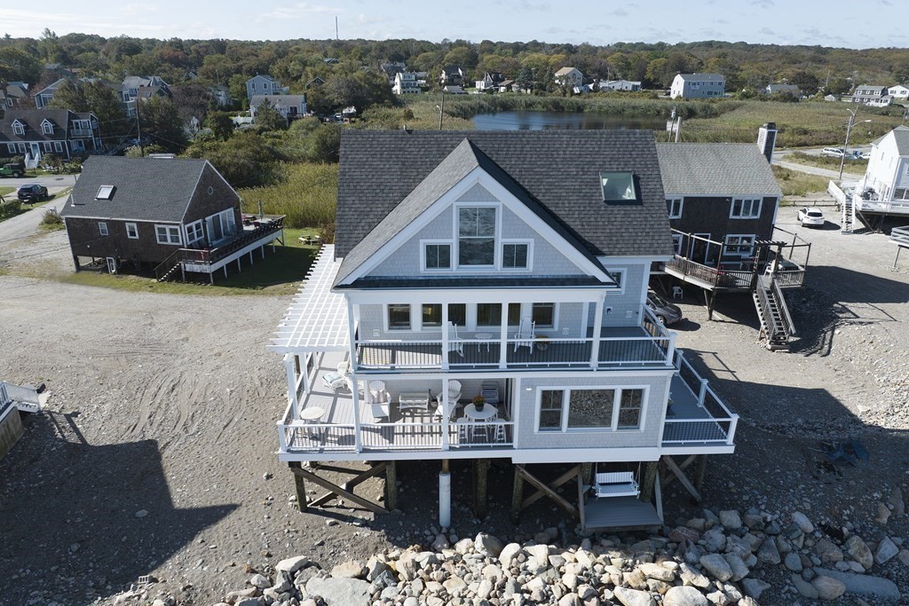61 Seaside Road Scituate, MA 02066 - Photo 5 of 39 a view of a house with roof deck