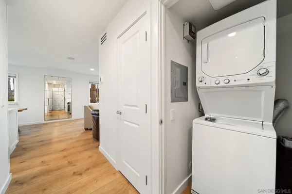 a view of a hallway with washer and dryer