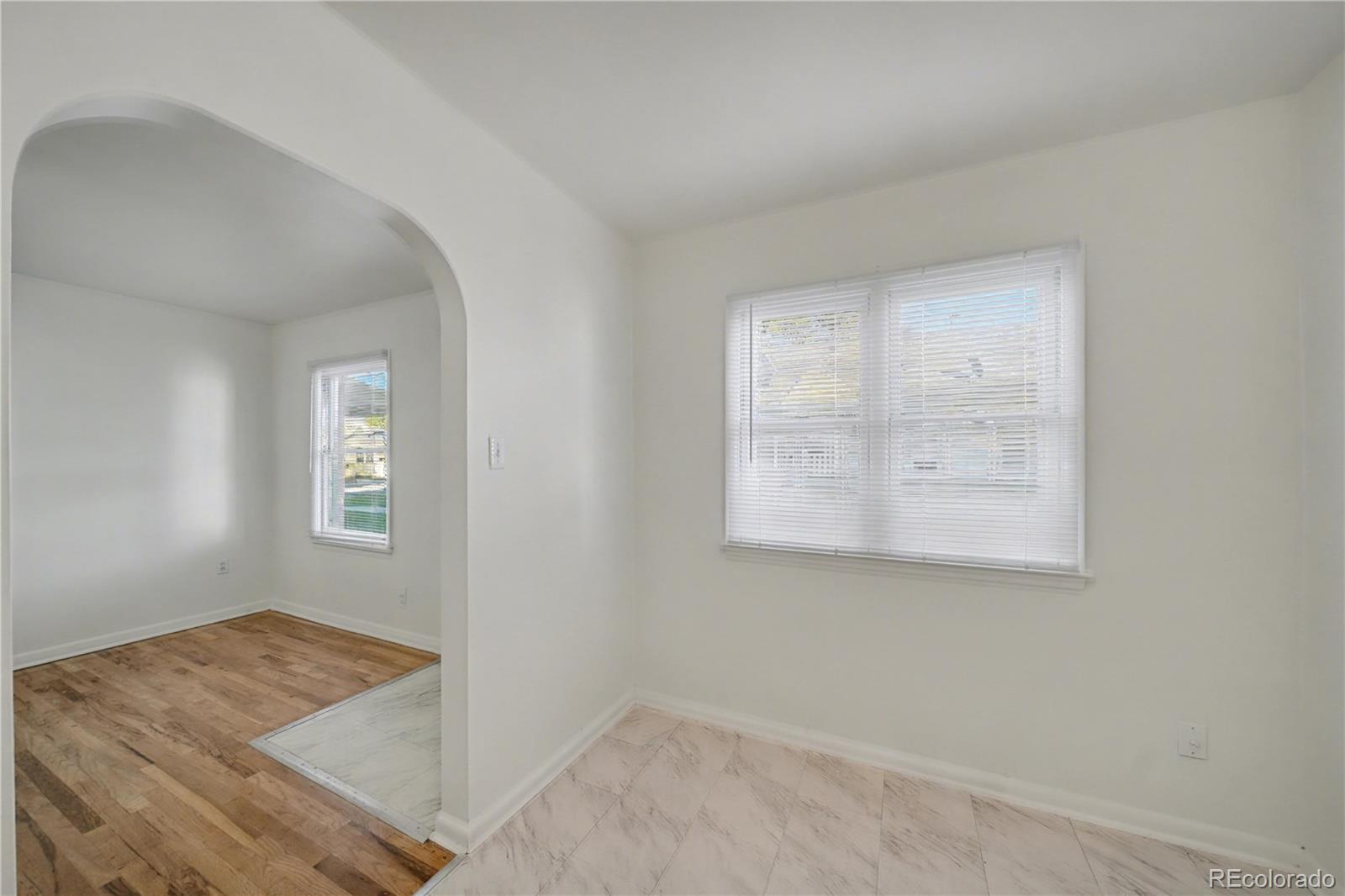 620 Strong Street, Unit 3 Brighton, CO 80601 - Photo 3 of 9 an empty room with a window
