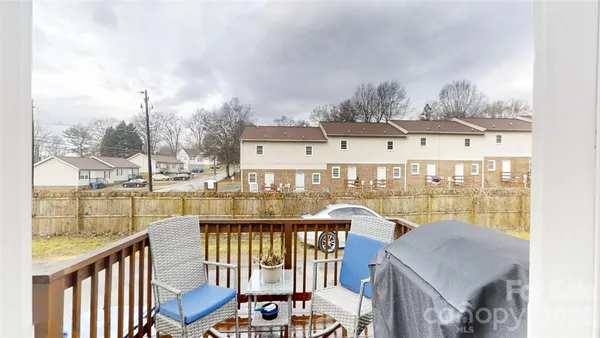 a view of a balcony with lake view and wooden floor