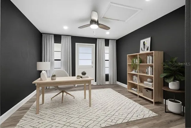 a workspace with furniture and window