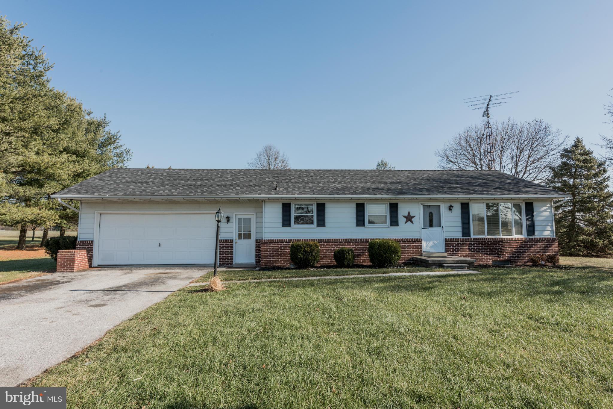 3569 Fringer Road Taneytown, MD 21787 - Photo 1 of 24 a front view of a house with a yard
