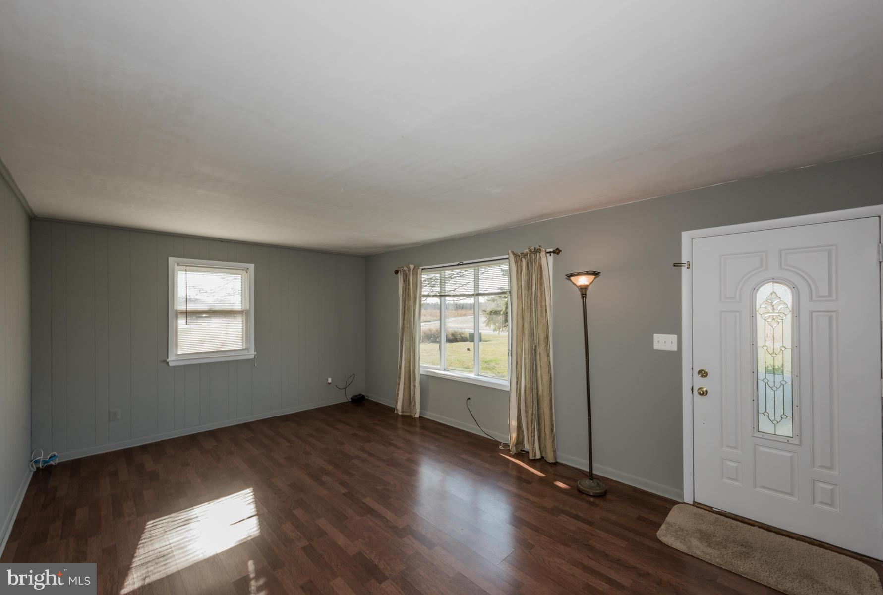 3569 Fringer Road Taneytown, MD 21787 - Photo 3 of 24 wooden floor in an empty room with a window