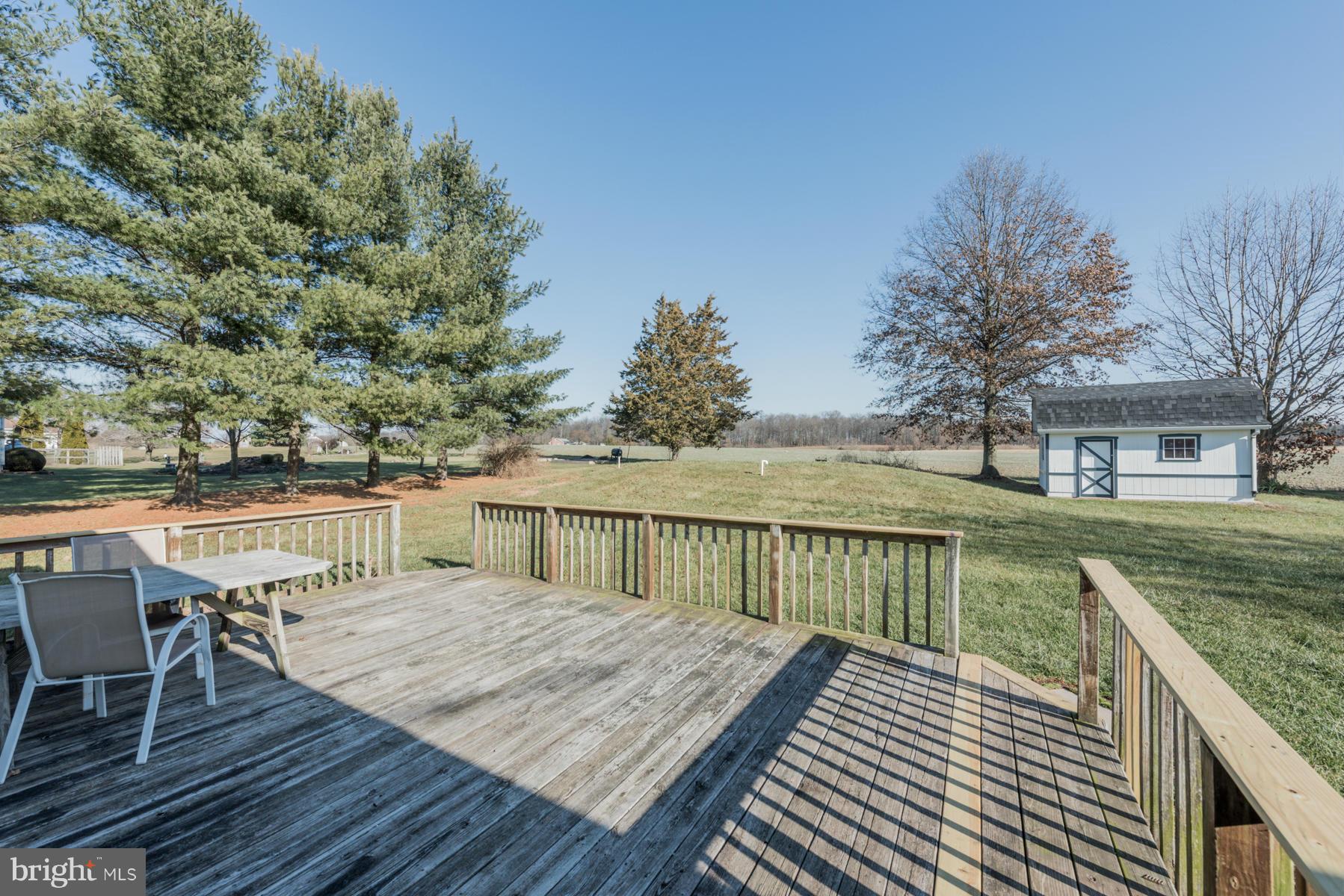 3569 Fringer Road Taneytown, MD 21787 - Photo 22 of 24 a balcony with wooden floor and fence