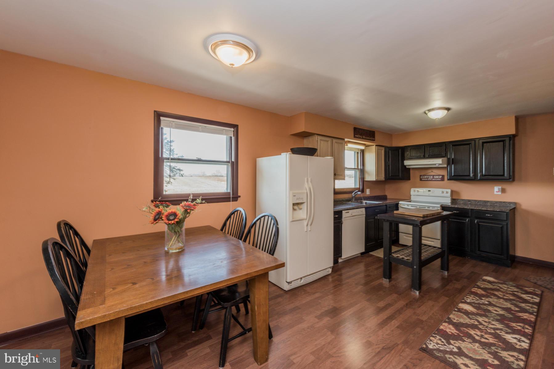 3569 Fringer Road Taneytown, MD 21787 - Photo 5 of 24 a view of a dining room with furniture and wooden floor