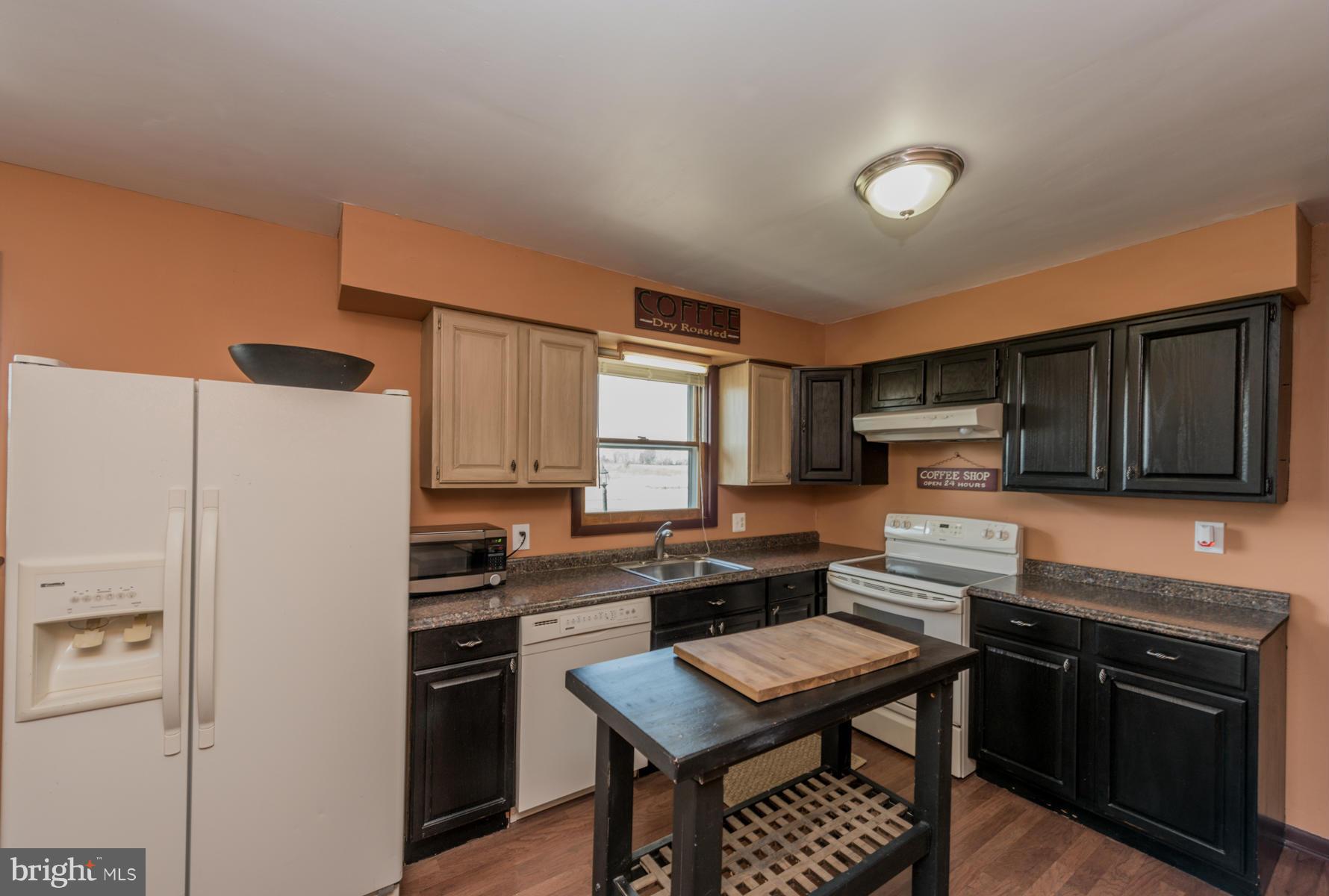 3569 Fringer Road Taneytown, MD 21787 - Photo 7 of 24 a kitchen with stainless steel appliances a stove a refrigerator a sink and a dining table