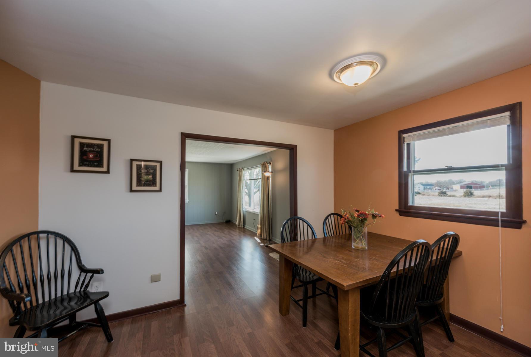 3569 Fringer Road Taneytown, MD 21787 - Photo 9 of 24 a view of a dining room with furniture and wooden floor
