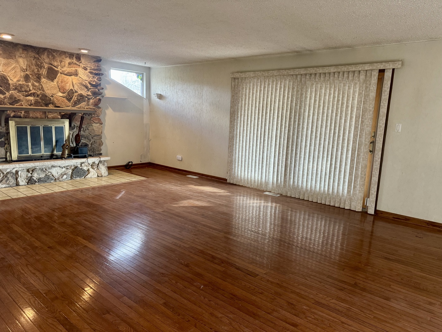 2939 East Hickory Lane Crete, IL 60417 - Photo 5 of 7 a view of an empty room with wooden floor and a window