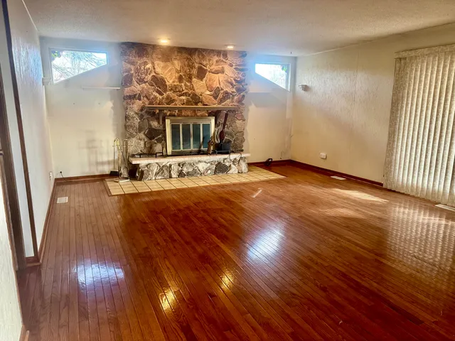 a view of a livingroom with wooden floor