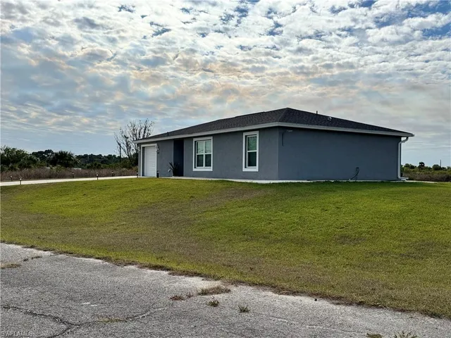 a house with a yard in front of it