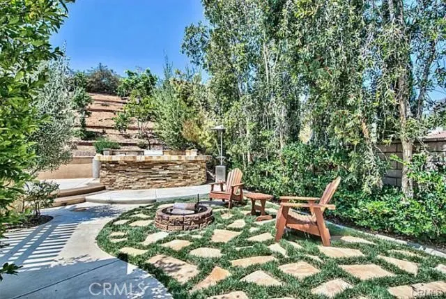 a view of a chairs and table in the patio