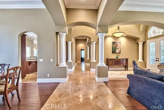 a lobby with furniture and wooden floor