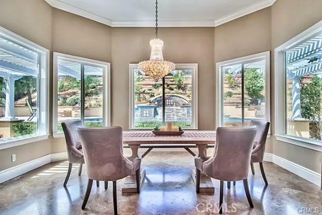 a dining room with furniture window and wooden floor