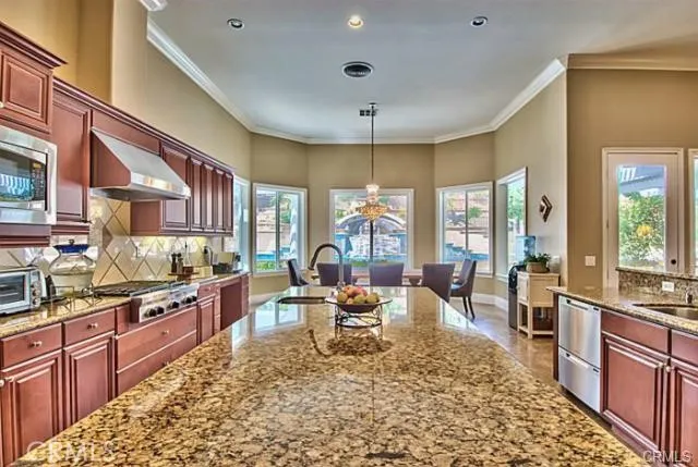 a large kitchen with granite countertop lots of counter top space