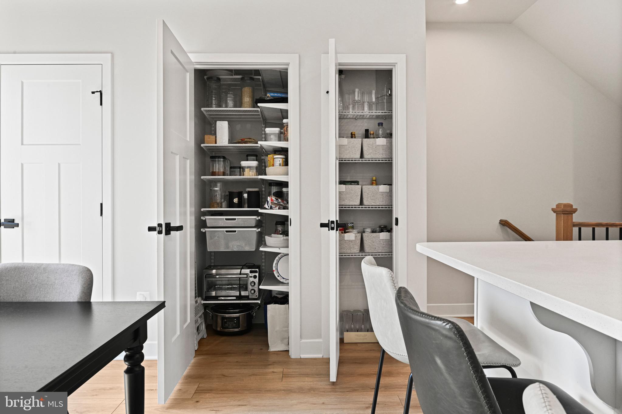 14008 Airfoil Road Herndon, VA 20171 - Photo 14 of 47 a kitchen with a table chairs refrigerator and cabinets
