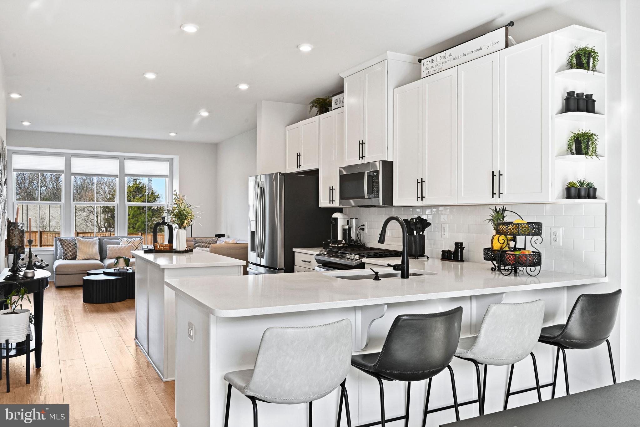 14008 Airfoil Road Herndon, VA 20171 - Photo 15 of 47 a kitchen with stainless steel appliances a table chairs refrigerator and cabinets