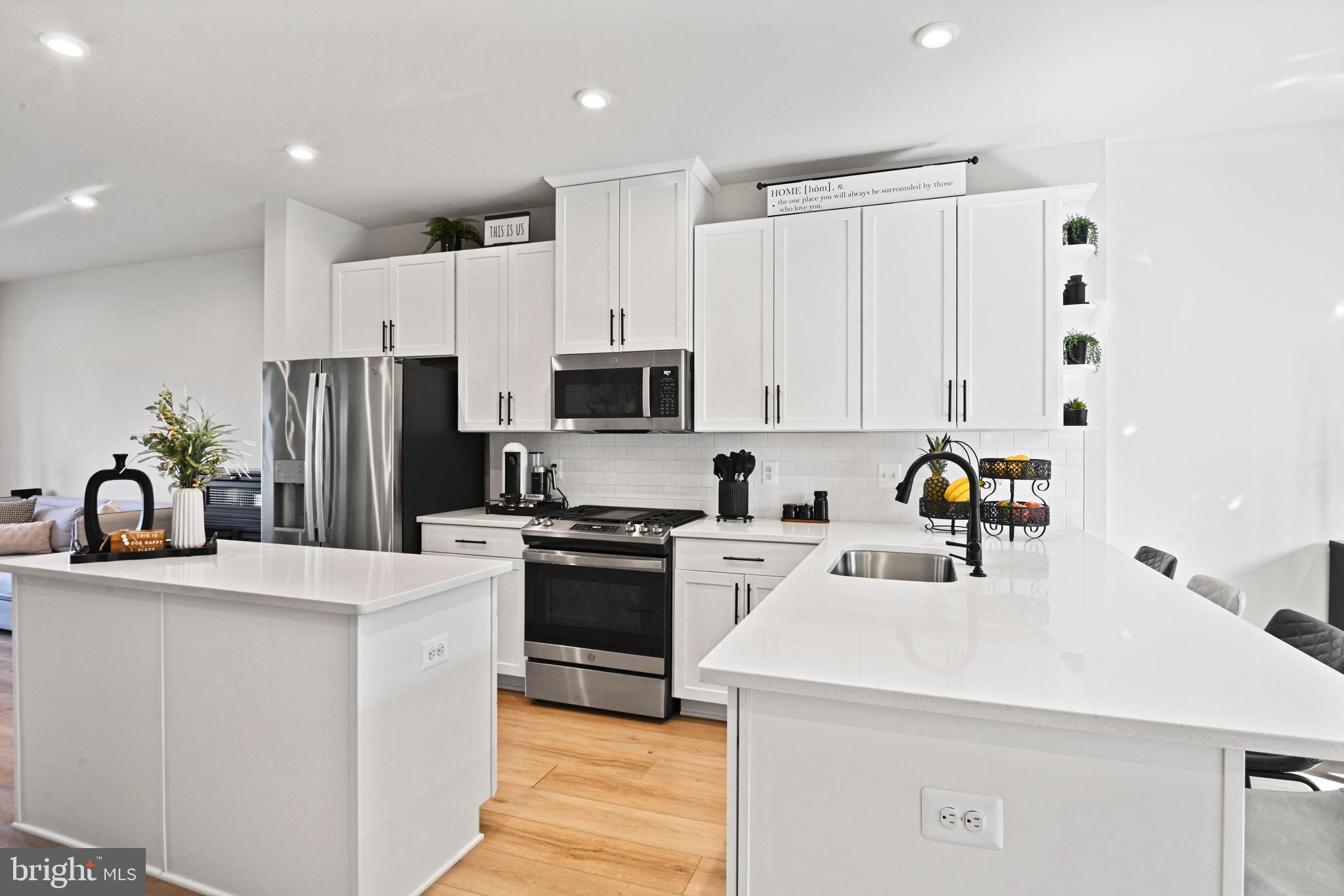 14008 Airfoil Road Herndon, VA 20171 - Photo 16 of 47 a kitchen with a sink a stove and refrigerator