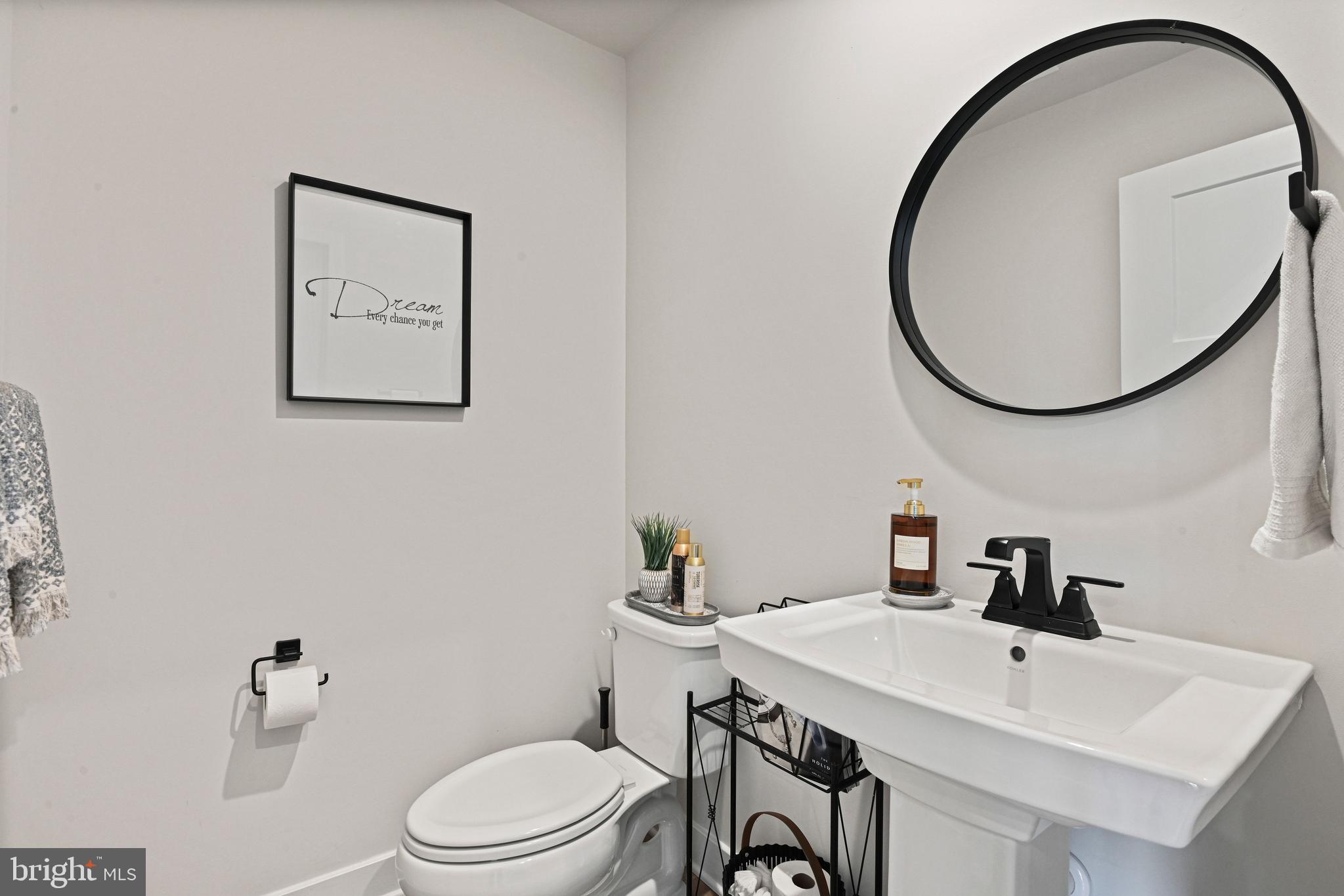 14008 Airfoil Road Herndon, VA 20171 - Photo 20 of 47 a bathroom with a toilet a sink and a mirror